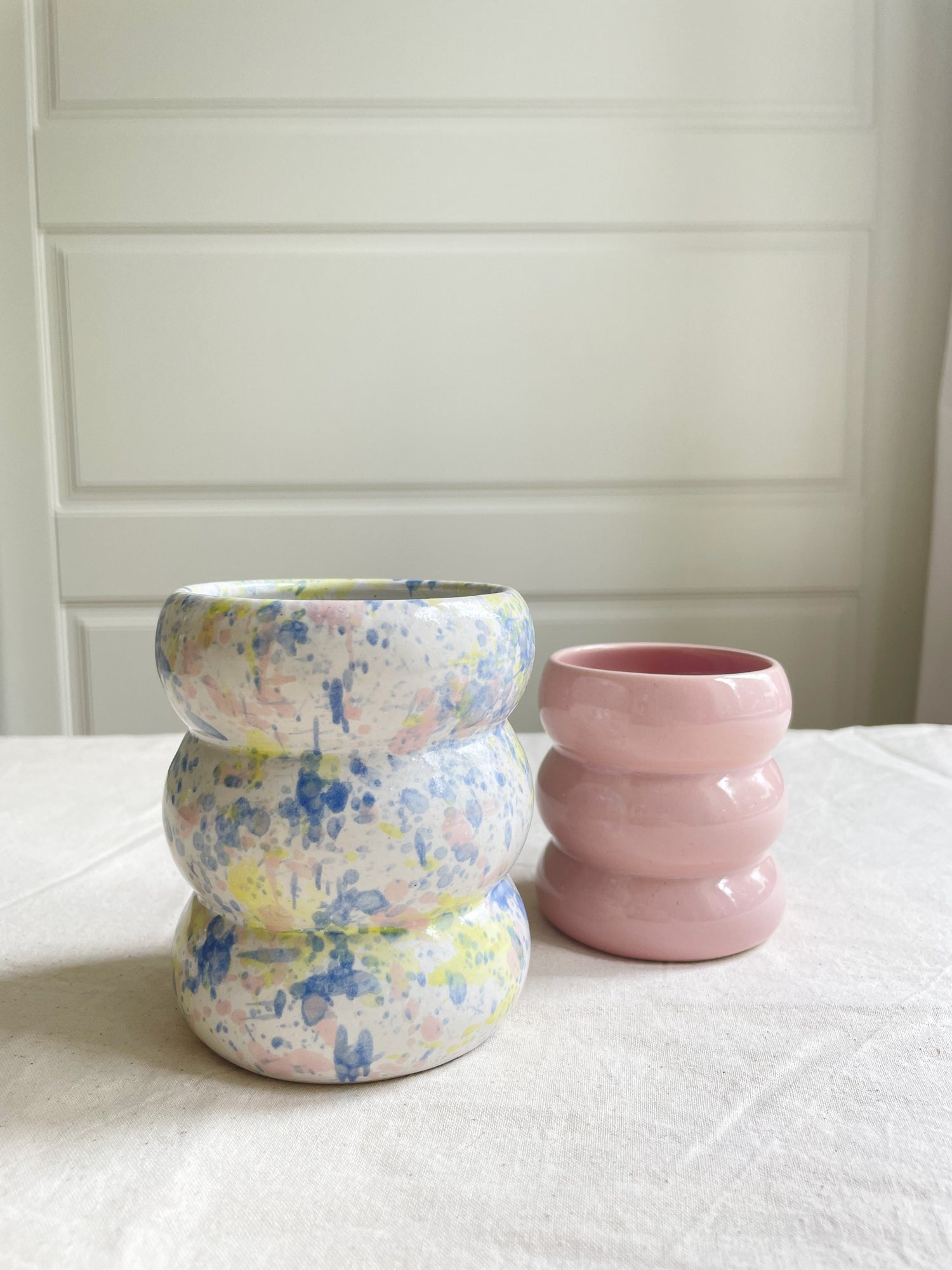 handmade ceramic mug with fun bubbled design and pastel colors