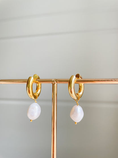thick gold hoops with a freshwater pearl charm