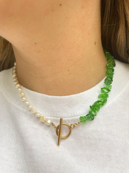 necklace with green irregular stones with freshwater pearls and a gold clasp at the front